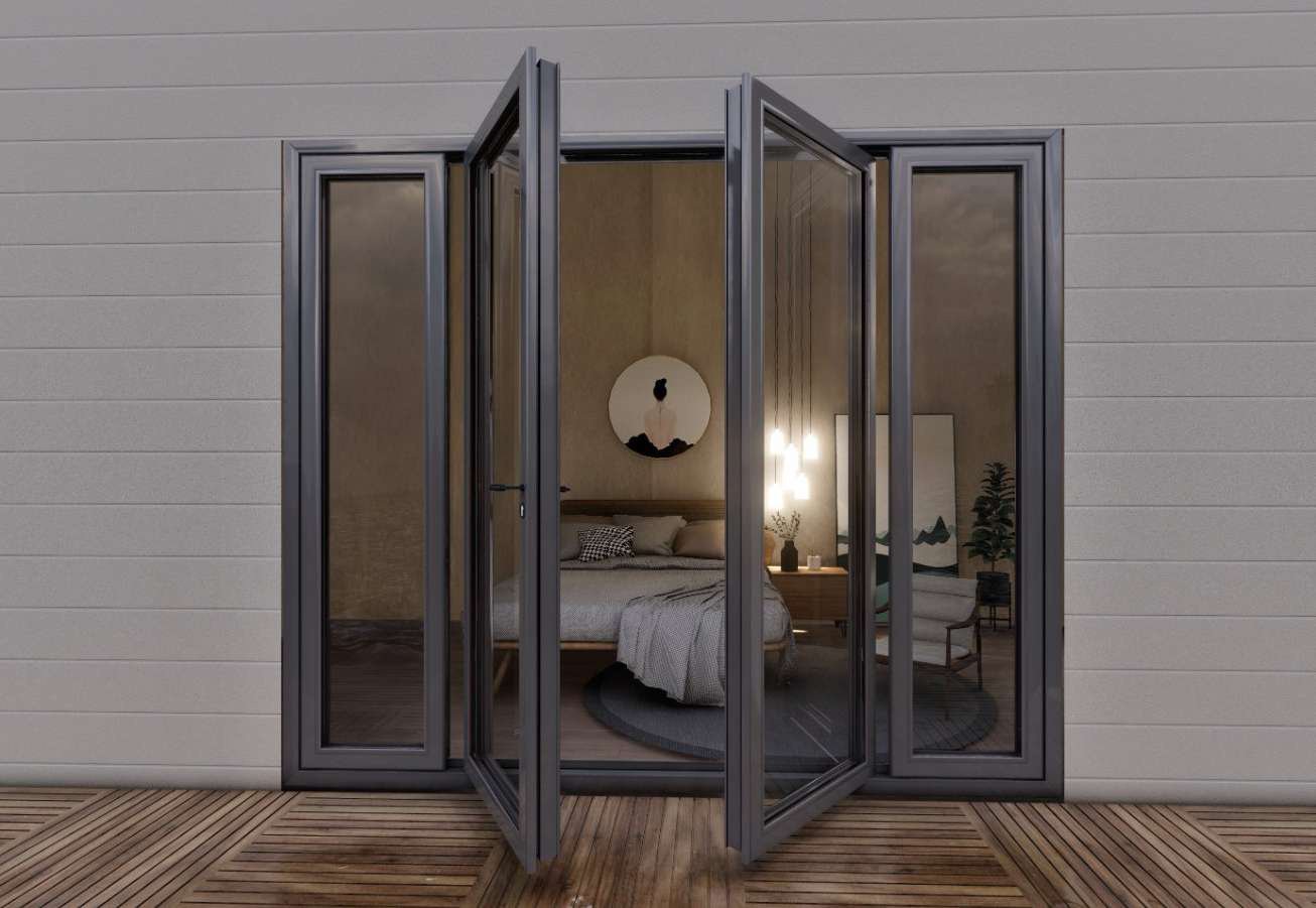 Grey aluminum double door with sidelights open onto a bedroom at dusk