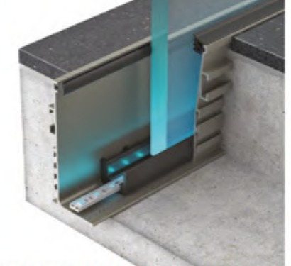 Cutaway of the aluminum base channel holding the glass, with the concealed LED strip in the cavity